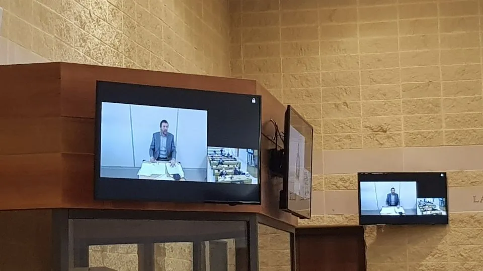 Lolli in videocollegamento dal carcere di Rossano Calabro (foto Newsrimini)