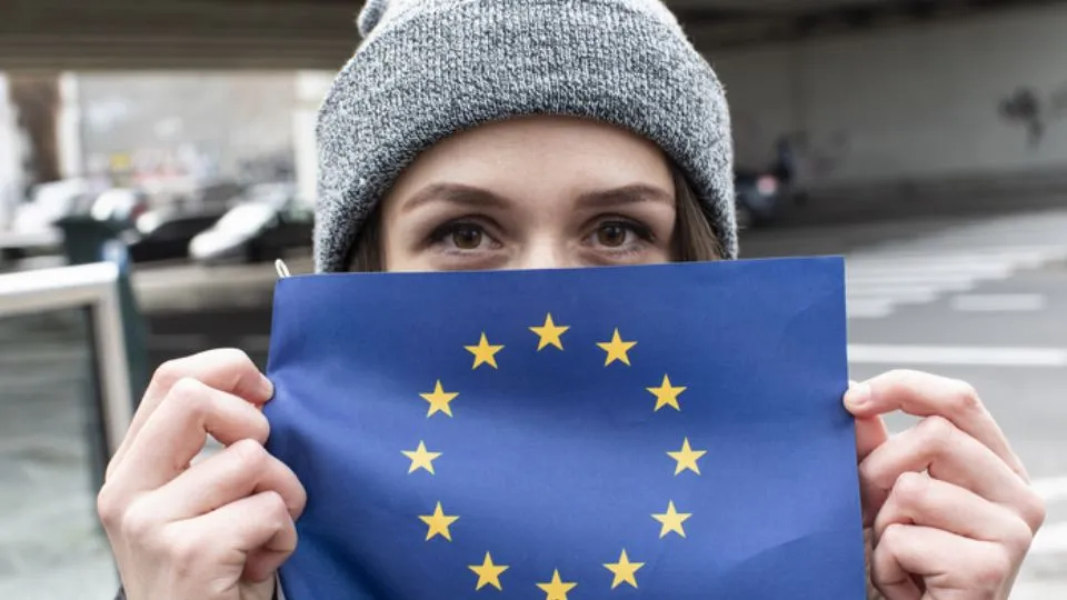 EU flags and hands
